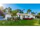 Landscaped front yard of a white single-story home at 6726 S Lockwood Ridge Rd, Sarasota, FL 34231