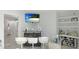 Home bar with wine storage, shelving, and seating for three at 6726 S Lockwood Ridge Rd, Sarasota, FL 34231
