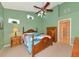 Bedroom with a wooden bed frame and access to bathroom at 7107 Cedar Hollow Cir, Bradenton, FL 34203
