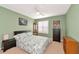 Guest bedroom with a double bed, dresser, and window with shutters at 7107 Cedar Hollow Cir, Bradenton, FL 34203