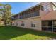 Two-story building with multiple balconies and lush lawn at 7107 Cedar Hollow Cir, Bradenton, FL 34203