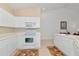 White kitchen with electric range, microwave, and ample counter space at 7107 Cedar Hollow Cir, Bradenton, FL 34203