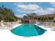 Community pool with plenty of lounge chairs at 7107 Cedar Hollow Cir, Bradenton, FL 34203