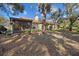 Landscaped backyard with mature trees and privacy at 7207 Oak Moss Dr # 63, Sarasota, FL 34241