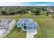 Aerial view of a completed home with a two-car garage at 75 Mark Twain Ln, Rotonda West, FL 33947