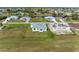 Aerial view of a house under construction and a completed home at 75 Mark Twain Ln, Rotonda West, FL 33947