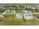 Aerial view of a completed house next to one under construction at 75 Mark Twain Ln, Rotonda West, FL 33947