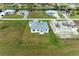Aerial view of a house under construction and a completed home at 75 Mark Twain Ln, Rotonda West, FL 33947