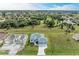 Aerial view of a completed home with a two-car garage at 75 Mark Twain Ln, Rotonda West, FL 33947