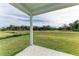 Spacious backyard with grassy area and open view at 75 Mark Twain Ln, Rotonda West, FL 33947