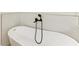 Bathroom with a bathtub and black matte fixtures at 75 Mark Twain Ln, Rotonda West, FL 33947