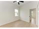 Bright bedroom with wood-look floors and ceiling fan at 75 Mark Twain Ln, Rotonda West, FL 33947