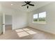 Bedroom with wood-look floors, large window, and view of nature at 75 Mark Twain Ln, Rotonda West, FL 33947