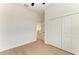 Bedroom with wood-look floors and white closet doors at 75 Mark Twain Ln, Rotonda West, FL 33947