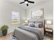 Comfortable bedroom with a queen-size bed and natural light at 75 Mark Twain Ln, Rotonda West, FL 33947