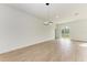 Spacious dining area with light wood floors and modern lighting fixture at 75 Mark Twain Ln, Rotonda West, FL 33947