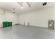 Attached garage with epoxy flooring and storage at 75 Mark Twain Ln, Rotonda West, FL 33947