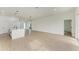 Modern kitchen island with white quartz countertop and black faucet at 75 Mark Twain Ln, Rotonda West, FL 33947