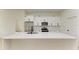 Modern kitchen with white quartz countertops and stainless steel appliances at 75 Mark Twain Ln, Rotonda West, FL 33947