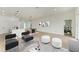 Bright and airy living room with large windows and modern furniture at 75 Mark Twain Ln, Rotonda West, FL 33947