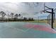 Outdoor basketball court with a hoop and seating at 7825 112Th E Ave, Parrish, FL 34219