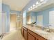 Double vanity bathroom with a large shower and granite countertop at 7825 112Th E Ave, Parrish, FL 34219