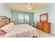 Primary bedroom with a king-size bed and plenty of natural light at 7825 112Th E Ave, Parrish, FL 34219