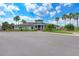 Community clubhouse with palm trees and parking at 7825 112Th E Ave, Parrish, FL 34219