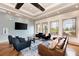 Community room with comfortable seating, large windows, and hardwood floors at 7825 112Th E Ave, Parrish, FL 34219