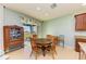 Charming dining area with round table and chairs near sliding doors at 7825 112Th E Ave, Parrish, FL 34219