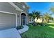 Front entry with screen door and nicely landscaped yard at 7825 112Th E Ave, Parrish, FL 34219