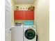Laundry room with washer, dryer, and ample cabinet space at 7825 112Th E Ave, Parrish, FL 34219