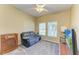 Relaxing living room featuring a comfortable couch and large TV at 7825 112Th E Ave, Parrish, FL 34219