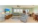 Living room with grey leather furniture and a large TV at 7825 112Th E Ave, Parrish, FL 34219