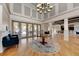 Elegant community lobby with hardwood floors and a large chandelier at 7825 112Th E Ave, Parrish, FL 34219