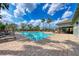 Community pool with a clubhouse and seating at 7825 112Th E Ave, Parrish, FL 34219
