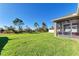 Large grassy backyard with screened porch at 7923 111Th E Ter, Parrish, FL 34219
