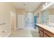 Spacious bathroom with walk-in shower, double vanity, and ample storage at 7923 111Th E Ter, Parrish, FL 34219