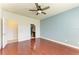 Bedroom with hardwood floors and en-suite bathroom at 7923 111Th E Ter, Parrish, FL 34219