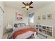 Cozy bedroom featuring a bed, nightstands, and built-in shelving at 7923 111Th E Ter, Parrish, FL 34219