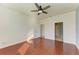 Primary bedroom with hardwood floors and access to bathroom at 7923 111Th E Ter, Parrish, FL 34219