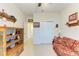 Bedroom with built-in shelving and a comfortable sofa at 7923 111Th E Ter, Parrish, FL 34219