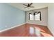 Bright bedroom with hardwood floors and ceiling fan at 7923 111Th E Ter, Parrish, FL 34219