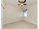 Bright bedroom with ceiling fan, window, and tiled floor at 7923 111Th E Ter, Parrish, FL 34219