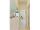 Bright hallway with large art piece and access to rooms at 7923 111Th E Ter, Parrish, FL 34219