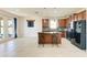 Kitchen with island, stainless steel appliances, and wood cabinets at 7923 111Th E Ter, Parrish, FL 34219
