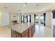 Open concept kitchen with large island and granite countertops at 7923 111Th E Ter, Parrish, FL 34219