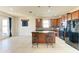 Open kitchen with island and access to backyard at 7923 111Th E Ter, Parrish, FL 34219