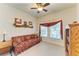 Home office with sofa, shelving, and large windows at 7923 111Th E Ter, Parrish, FL 34219