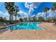 Resort-style pool with lounge chairs and palm trees at 7923 111Th E Ter, Parrish, FL 34219